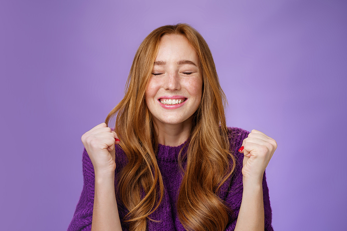 Woman celebrating earlybird win